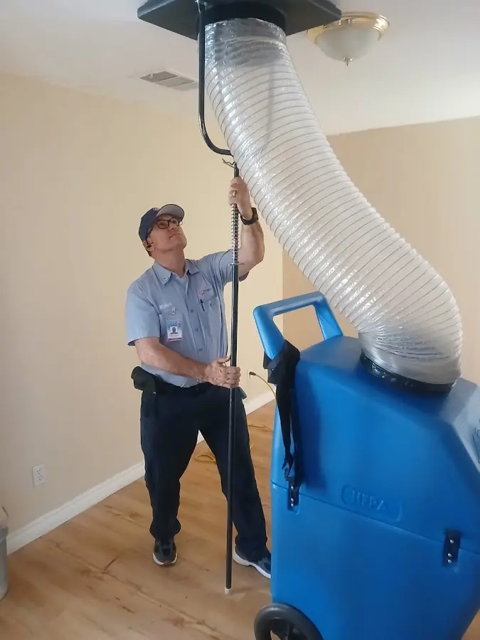 Furnace Tune-Up technician using HEPA equipment in Litchfield Beach
